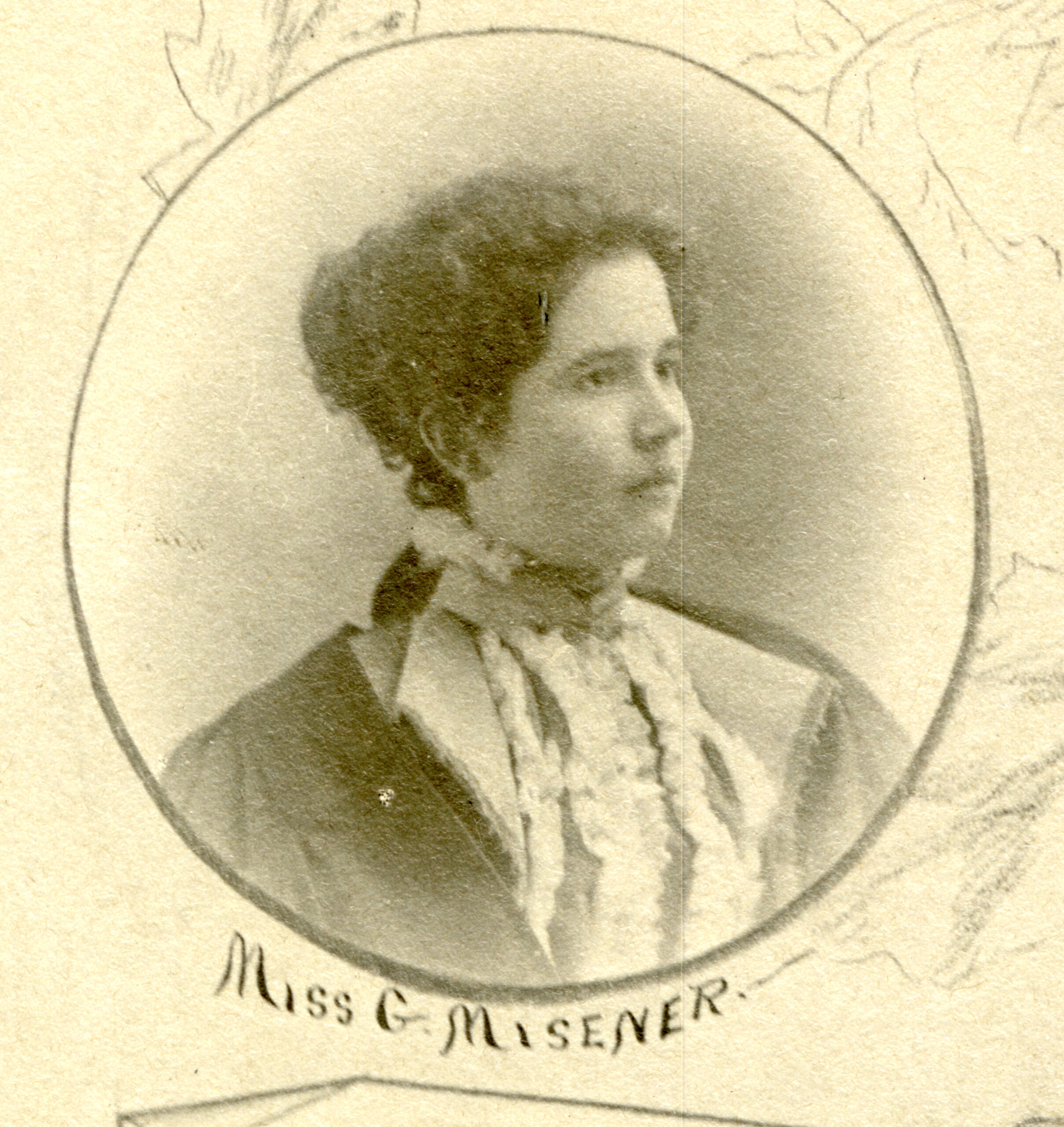 Senior portrait of a young white woman with dark hair wearing a high-collared dress. Text read “Miss G. Misener.” It is the senior photo of Geneva Misener from Queen’s University.